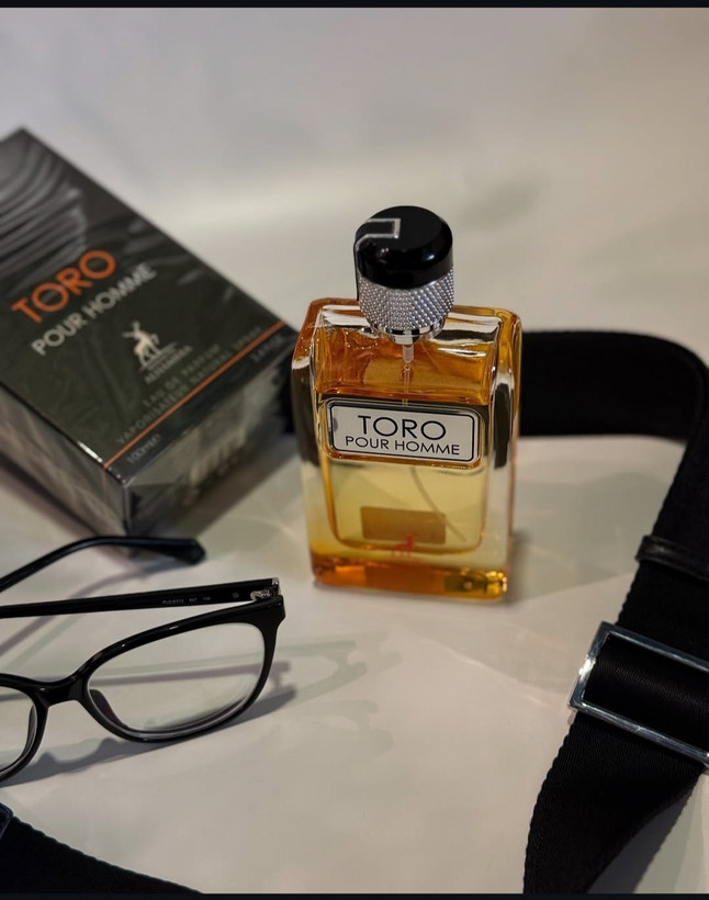 ادکلن مردانه شرکت الحمبرا مدل تورو هوم رایحه تق هرمس حجم 100 میل