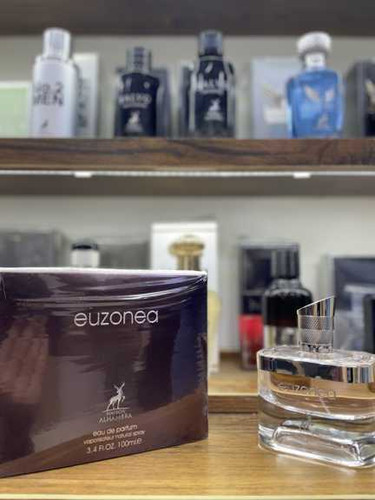 ادکلن زنانه شرکت الحمبرا مدل اوزونیا رایحه ایفوریا حجم 100 میل